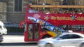 City sightseeing bus motion in the traffic road and blurred taxi