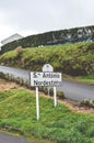 City sign Santo Antonio de Nordestinho in Sao Miguel Island, Azores, Portugal. Rural road on the hill, green grass