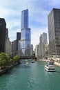 The city skyline along the Chicago River, with passengers tourist boats sailing around