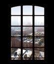 City skyline from an apartment or office window on a bright sunny day. View from inside an empty dark penthouse or hotel Royalty Free Stock Photo