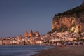 City skyline of Cefalu with mountain Rocca di Cefalu and beach during sunset, Sicily Italy Royalty Free Stock Photo