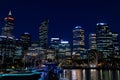 City skyline of the commercial business district CBD at night. Neon lights and office buildings skyscrapers. Perth capital city of