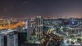 City skyline with commercial port of Singapore aerial night timelapse.
