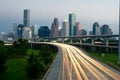 City skyline at dusk with traffic Royalty Free Stock Photo