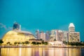 City skyline with Esplanade theatre and bridge with Singapore river embankment at night in Marina bay, Singapore Royalty Free Stock Photo