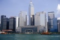 City skyline and ferry in Hong Kong Harbor Royalty Free Stock Photo