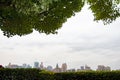 City skyline with green trees