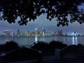 City skyline at night as seen from park bench Royalty Free Stock Photo