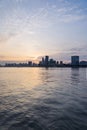 City Skyline By River Against cloudy Sky in Shanghai