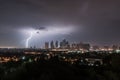 city skyline with view of towering clouds and lightning after hurricane has passed Royalty Free Stock Photo