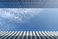 City skyscrapers bottom view against blue sky. Low wide angle shot, from ground. Glass facade Architecture exterior. Royalty Free Stock Photo