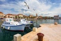 City of Split with colorful fishing boats in harbor, Dalmatia, Croatia. Waterfront view of fishing boats at mediterranean scenery