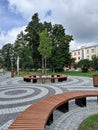 City square with a decorative tiles, benches and trees in Penza, Russia