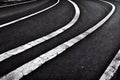 City street with crooked road lines geometric pattern abstract seamless highway background. Aged grungy urban roadway