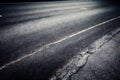 City street with crooked road lines geometric pattern abstract seamless highway background. Aged grungy urban roadway