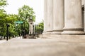 City Street Crossing Beside a Building Fronted with Stone Pillars