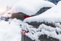 City street driveway parking lot spot with small car covered snow stuck trapped after heavy blizzard snowfall winter day Royalty Free Stock Photo