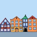 City street with front view houses. Old houses facades with doors windows and balcony in bright color