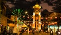 Betong Thailand. A city street at night with a large clock tower in the background Royalty Free Stock Photo