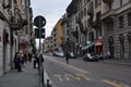 City street panorama. People are standing at the bus stop.