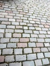City street paved with colorful cobblestones pavement