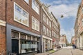 a city street with a red brick building with windows Royalty Free Stock Photo