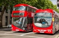 City street with red double decker buses in london Royalty Free Stock Photo