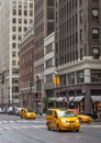 City street scene with a yellow taxi cabs Royalty Free Stock Photo