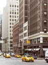 City street scene with a yellow taxi cabs Royalty Free Stock Photo