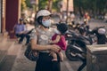 On the city street, two girls in blindfolds, the concept of the spread of the coronavirus from China, toned