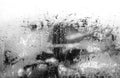 City street windshield abstract background water drop on the glass lights and rain. Black and white photo Royalty Free Stock Photo