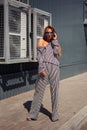 City Style. Designer clothing. Girl in pajamas in the city