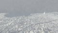 City surrounded by the ocean from sky at snowing