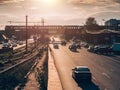 City traffic on asphalt road at sunset time, lot of cars drive with fast speed, blurred urban transportation cityscape Royalty Free Stock Photo