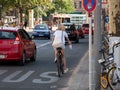 City Traffic: Cyclist Between Cars In Berlin, Germany