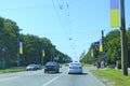 City traffic in Kharkiv on street decorated Ukrainian national flags