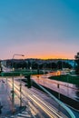 City traffic lights in rainy evening,Prague,Czech republic.Long exposure lights.Movement of cars at colorful sunset.Night town Royalty Free Stock Photo