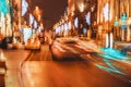 City traffic at night, auto with bright brake lights, city street lights and speed. Abstract urban blurred background Royalty Free Stock Photo