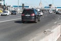 City trafic on the road. Black minivan Ford Galaxy Second generation car drives on Moscow streets. Side rear view of a minivan Royalty Free Stock Photo