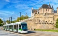 City tram at the Castle of the Dukes of Brittany in Nantes, France Royalty Free Stock Photo