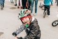 City Tula. Russia - April 06, 2019: little boy in a protective helmet on amateur competition of children to balance bicycle