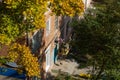 City Tula. Russia - September, 29 , 2021 A mans house painters paint a residential building on a front lift