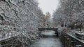 City of Uppsala with a bridge over the river in the middle of the snow-covered trees in Sweden Royalty Free Stock Photo