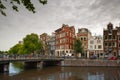 City view of Amsterdam canal Singel and typical houses, Holland, Netherlands.
