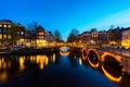 City view of Amsterdam, the Netherlands with Amstel river at night Royalty Free Stock Photo