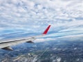 City view with clouds and sky as seen through window of an aircraft Royalty Free Stock Photo