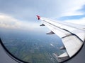 City view clouds and sky as seen through window of an aircraft. Royalty Free Stock Photo