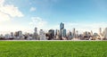 City view with grass lawn, eco-friendly building Royalty Free Stock Photo