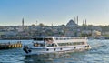 City view of Istanbul, Turkey from the sea overlooking a passing ferry with Eminonu district and Sulaymaniye Mosque Royalty Free Stock Photo