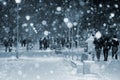 City view, lights, falling snow, night, street, bokeh spots. Blue color Royalty Free Stock Photo